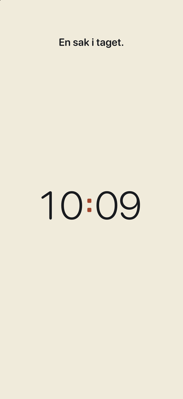 Ett kort personligt meddelande med färgstilen Papper. Clock Pro. Exempeltext som lagras på enheten.